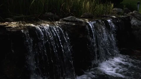 Waterfall from the stream to the lake of the mansion Stock Footage 138113079