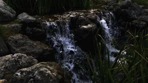 Waterfall from the stream to the lake of the mansion Stock Footage 138113085