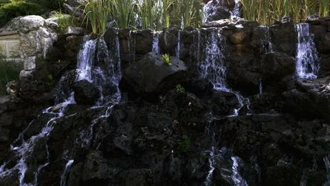 Waterfall from the stream to the lake of the mansion Video stock 138113254