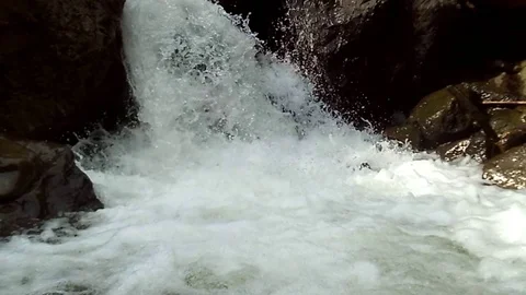 A waterfall stream with lots of white foam Stock Footage 123948116