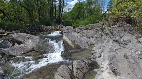 Waterfall stream rocks aerial Stock Footage 99042772