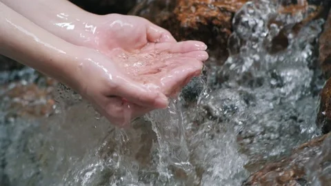 Waterfall stream splash of pure water pouring into hands Stock Footage 150475254