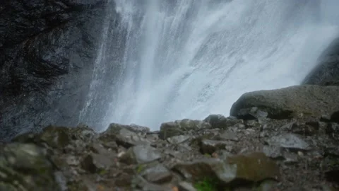 Waterfall stream surrounded by stones Stock Footage 220943211