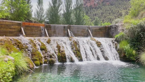 A waterfall with a stream of water flowing down it Stock Footage 277410310