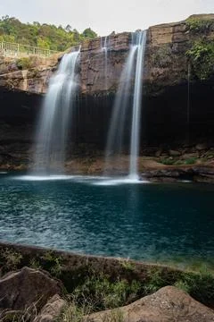 Waterfall streams falling from mountain top at morning long exposure shot fro 스톡 사진