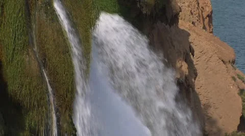 Waterfall. Streams of river water break from rock and fall to sea 動画素材 8966320