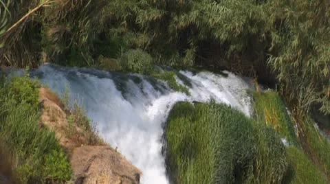 Waterfall. Streams of river water break from rock and fall to sea Stock Footage 8966323