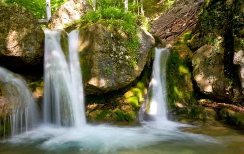 Waterfall in summer forest Stock Photos