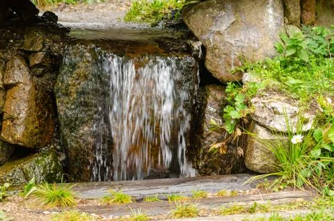 Waterfall in summertime Stock Photos