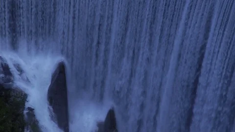 Waterfall at sunset, dark mood. Stock Footage