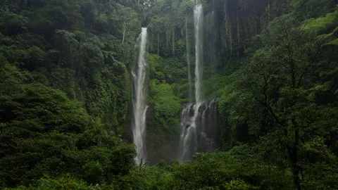 Waterfall surrounded by forest Biggest Sekumpul Slow motion Stock Footage 276832522