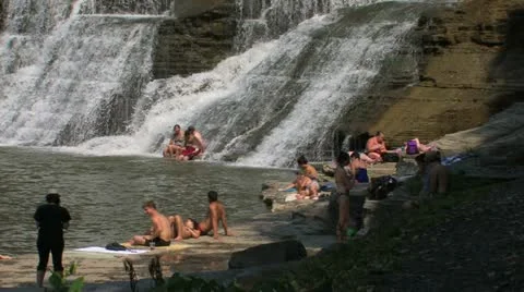 Waterfall with Swimmers &amp; Sunbathers 動画素材 11367529