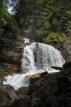 Waterfall through lush environment Stock Photos