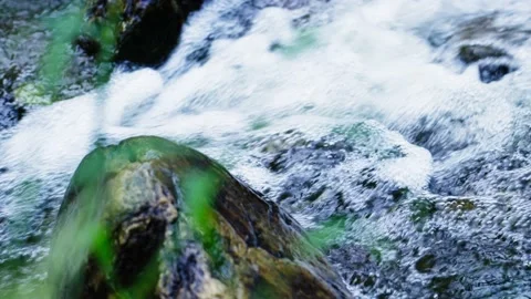 A waterfall torrent pours down the river Stock Footage 235906100