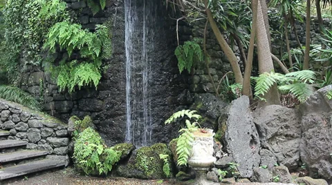A waterfall in tropical garden Stock Footage 28330672