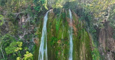 Waterfall in tropical jungle forest with bright sunlight rays Dominican republic Stock Footage 338985586