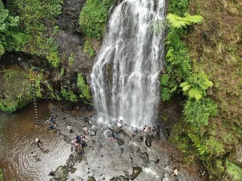 Waterfall on tropical mountain, Java, Indonesia. Stock Photos