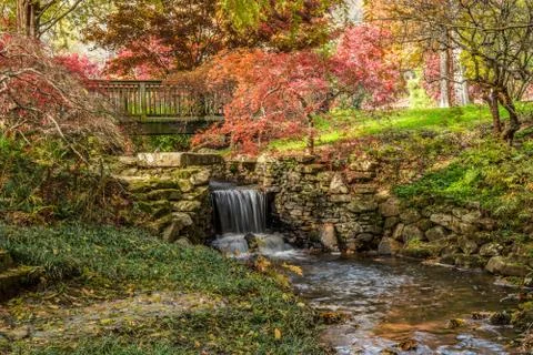 Waterfall under a bridge closeup Stock Photos