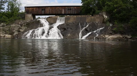 Waterfall under covered bridge Stock Footage 39540639