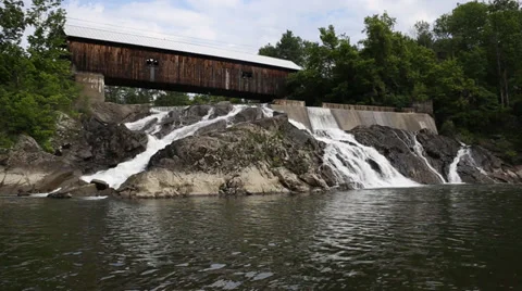 Waterfall under a covered bridge Stock Footage 39540661