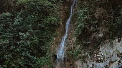 Waterfall in the valley of the Caucasian mountains Видео 80558733