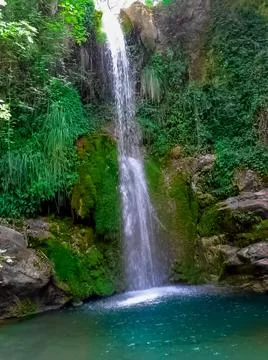 A waterfall in the valley Stock Photos