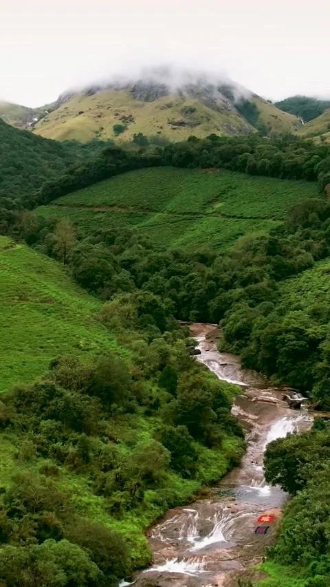 Waterfall view from lush green forest. Kapimala Kannur Stock Footage 288797173