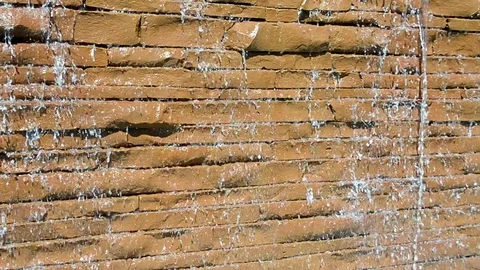 Waterfall with water drops on the brown stone wall, environment, travel. Stock Footage 72933052