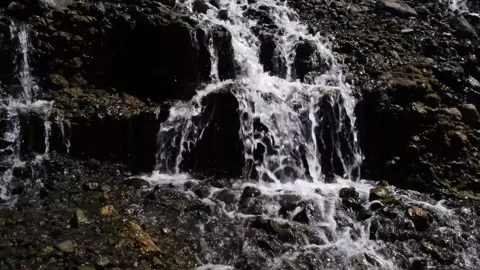 Waterfall water flows over solid rocks Stock Footage 260526520