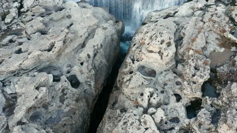 Waterfall on wide mountain river surrounded by rock. Water falling in cascade Stock Footage 167568873