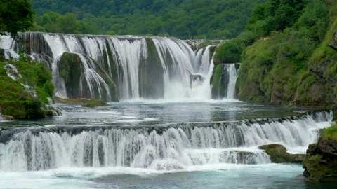 Waterfall on a wild river in the rainforest, Beautiful nature, jungle waterfall Stock Footage