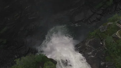 Waterfall in the wilderness falling down captured from above Stock Footage 255392288
