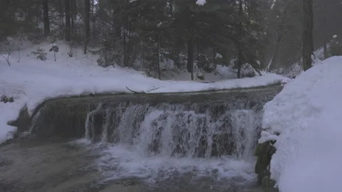 Waterfall in the winter forest, 8K Stock Footage 163111968