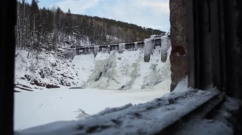 Waterfall in the winter forest. Old micro hydro power plant Stock-Footage 64465456