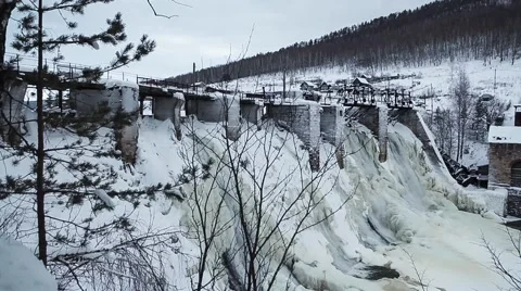 Waterfall in the winter forest. Old micro hydro power plant Stock Footage 64466019