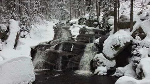 Waterfall in winter. A long waterfall in the Jizera Mountains Stock Footage 148081925