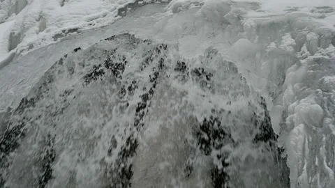 Waterfall in the winter in the mountains. Video stock 121901020