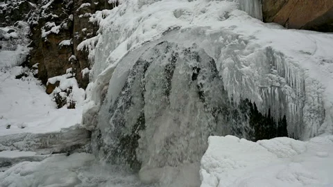 Waterfall in the winter in the mountains. Video stock 121902792