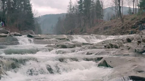Waterfall in the Winter. Rapid Flow of Water from a Mountain Creek Stock Footage 147184647