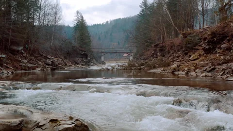 Waterfall in the Winter. Rapid Flow of Water from a Mountain Creek Stock Footage 147184891