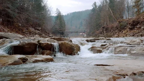 Waterfall in the Winter. Rapid Flow of Water from a Mountain Creek Stock Footage 147185112