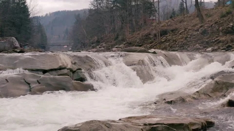 Waterfall in the Winter. Rapid Flow of Water from a Mountain Creek Stock Footage 147185365
