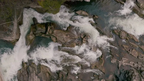 Waterfall in the Winter. Rapid Flow of Water from a Mountain Creek Stock Footage 147185562