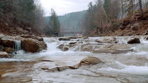Waterfall in the Winter. Rapid Flow of Water from a Mountain Creek Stock Footage 147185793