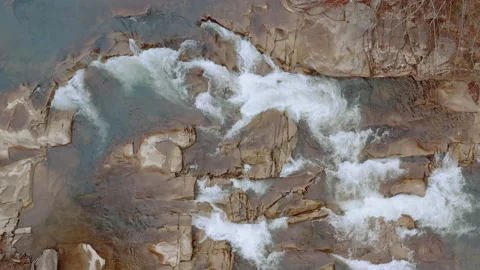 Waterfall in the Winter. Rapid Flow of Water from a Mountain Creek Stock Footage 147186663