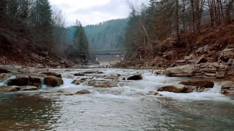 Waterfall in the Winter. Rapid Flow of Water from a Mountain Creek Stock Footage 147187464