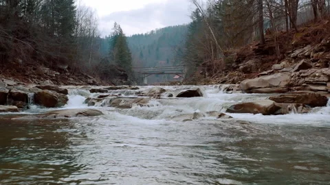 Waterfall in the Winter. Rapid Flow of Water from a Mountain Creek Stock Footage 147187858