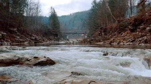 Waterfall in the Winter. Rapid Flow of Water from a Mountain Creek Stock Footage 147189515