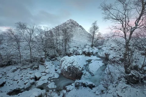 Waterfall in winter on the River Coe in Glencoe in the Scottish Highlands Stock Footage 262284316