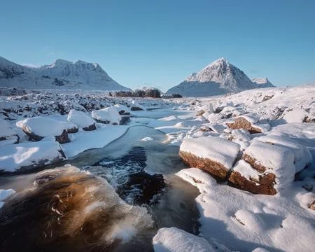 Waterfall in winter on the River Coe in Glencoe in the Scottish Highlands Stock Photos